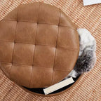Pouffe de rangement rond capitonné en similicuir avec pieds en bois
